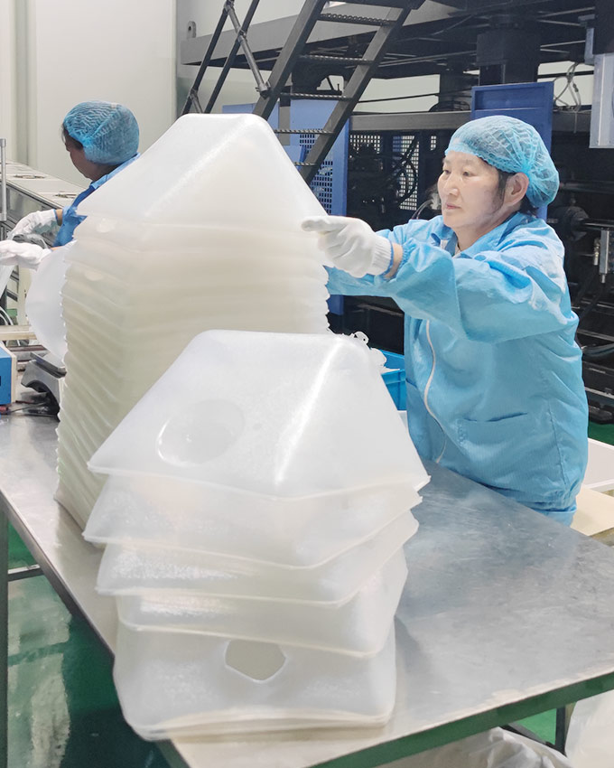 Production support for flexible liquid packaging manufacturing